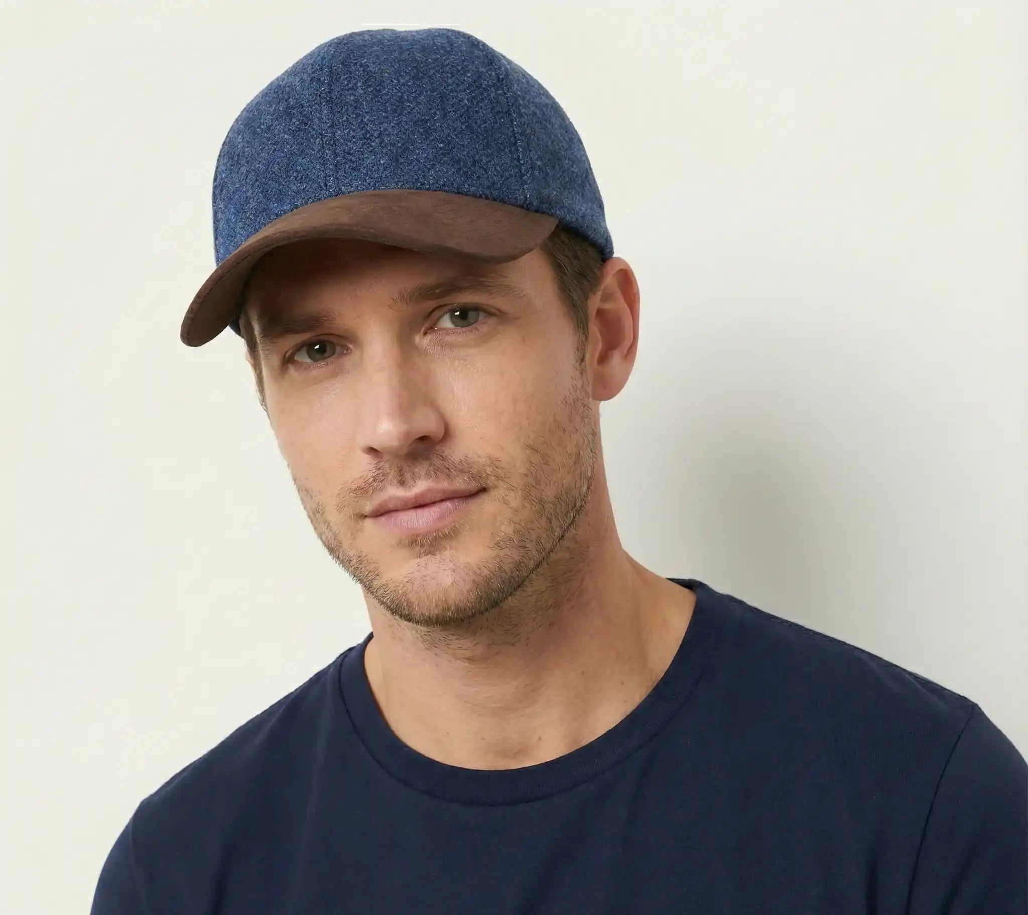 Premium wool & suede baseball cap with adjustable buckle for a perfect fit. Stylish, comfortable, and ideal for everyday wear. Shop Novella Hats.