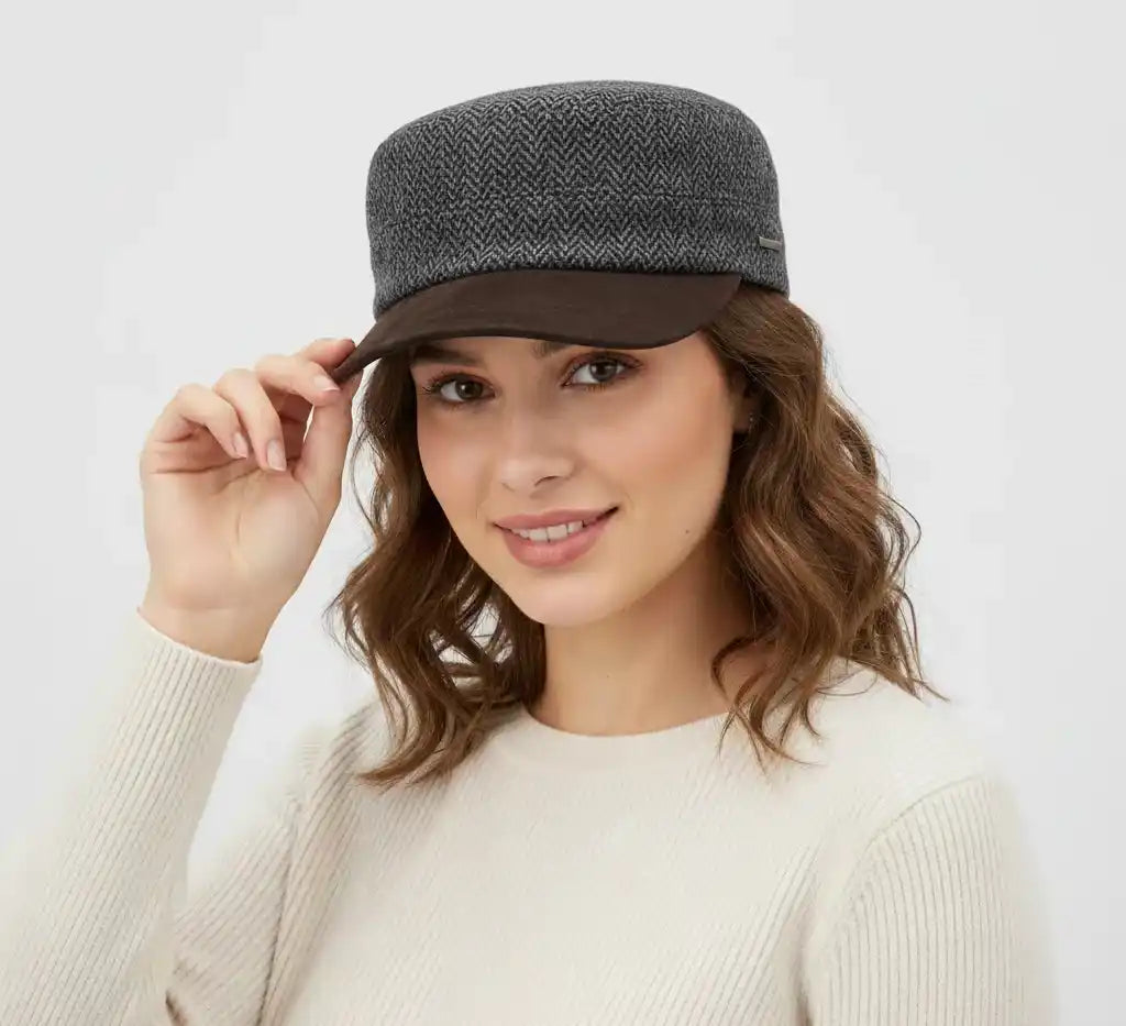 The Novella Hats Herringbone Army Cap is a modern take on the classic military-style cap, crafted for everyday wear. Made from a premium wool-blend fabric, it offers a clean silhouette with a timeless herringbone pattern in green or grey.
