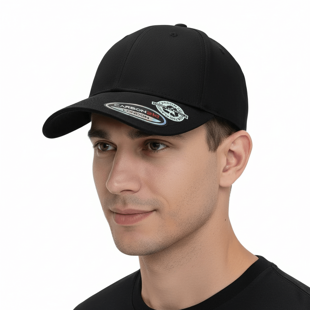 Black eco-friendly recycled cotton baseball cap by Carbon212. Made from 60% recycled cotton, this cap features a pre-curved visor, buckle closure, and cotton sweatband. One size fits all.